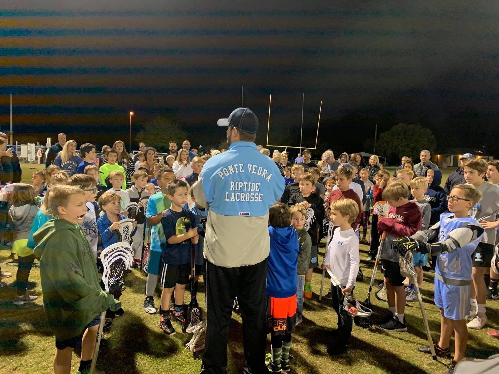 Ponte Vedra Lacrosse players and coaches together at Davis Park