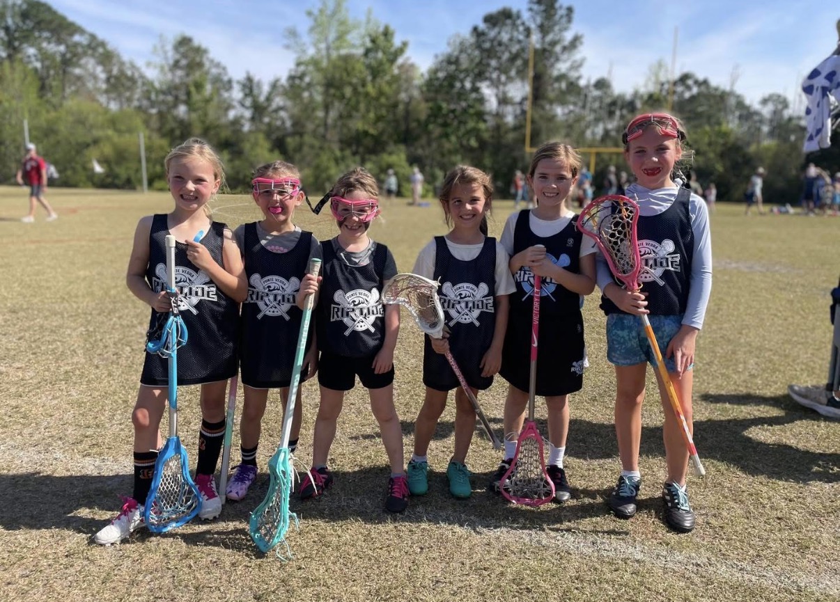 Young Girls Riptide teammates together on the field
