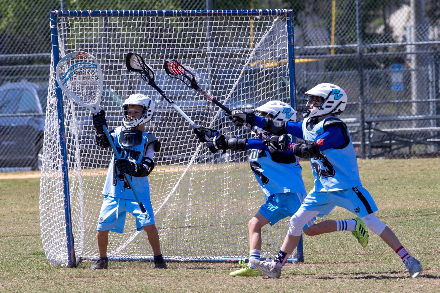 Young Boys Riptide players defending the goal together
