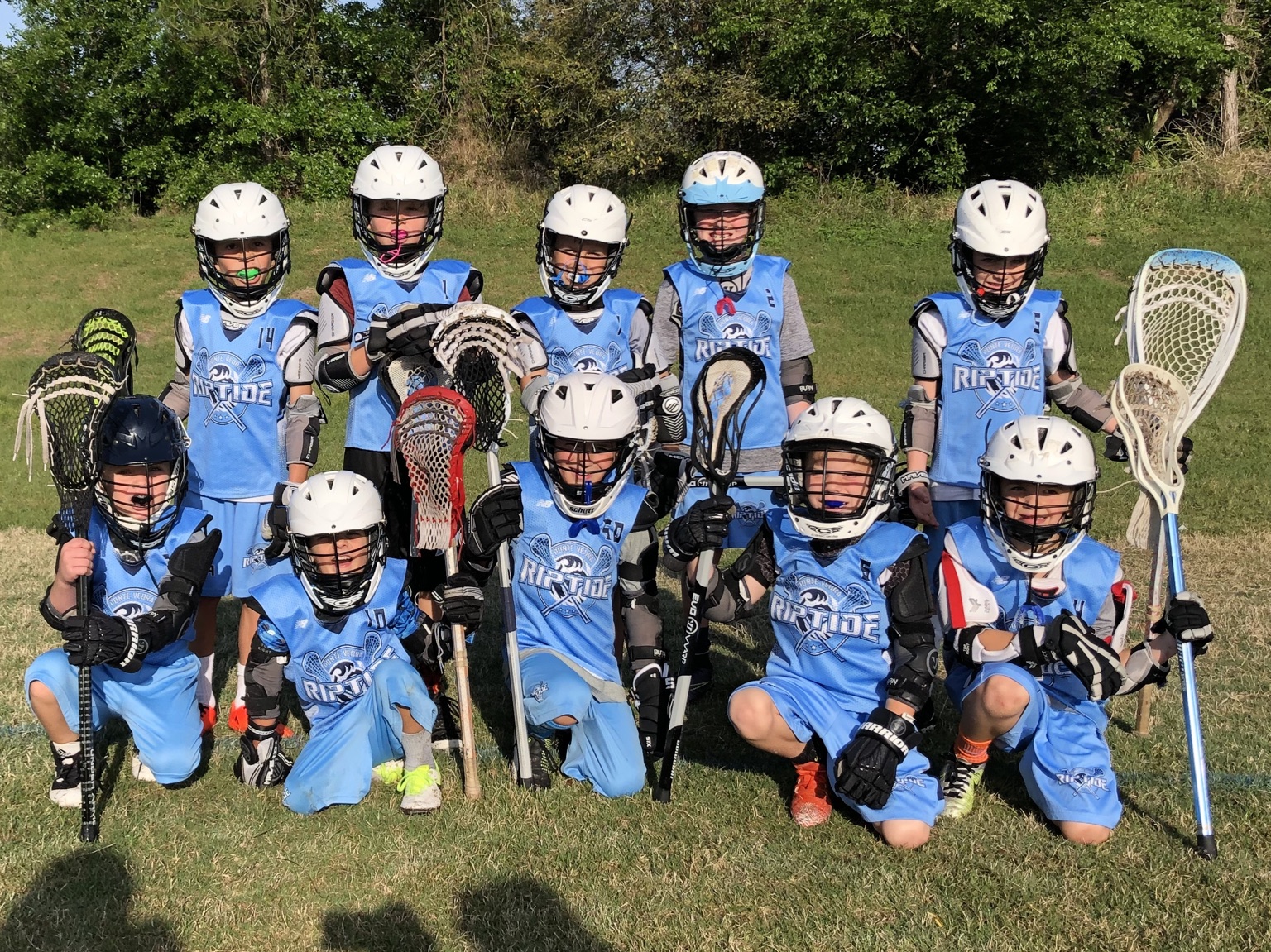 Boys Riptide team together on the field
